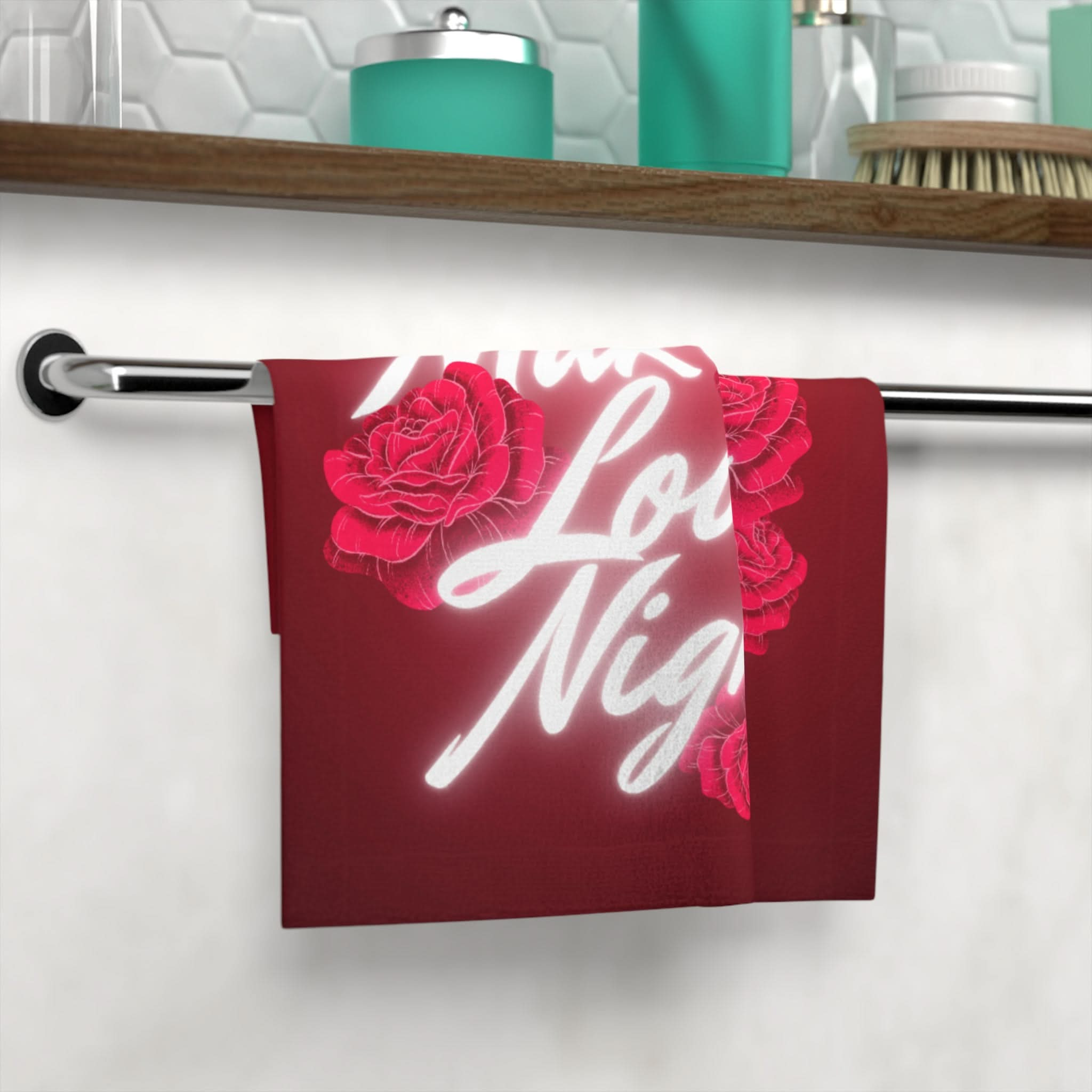 Make Love Night Best After-Sex Towel in deep red with bold white lettering and floral accents, hanging on a bathroom towel bar. Perfect for intimacy and romantic cleanup.