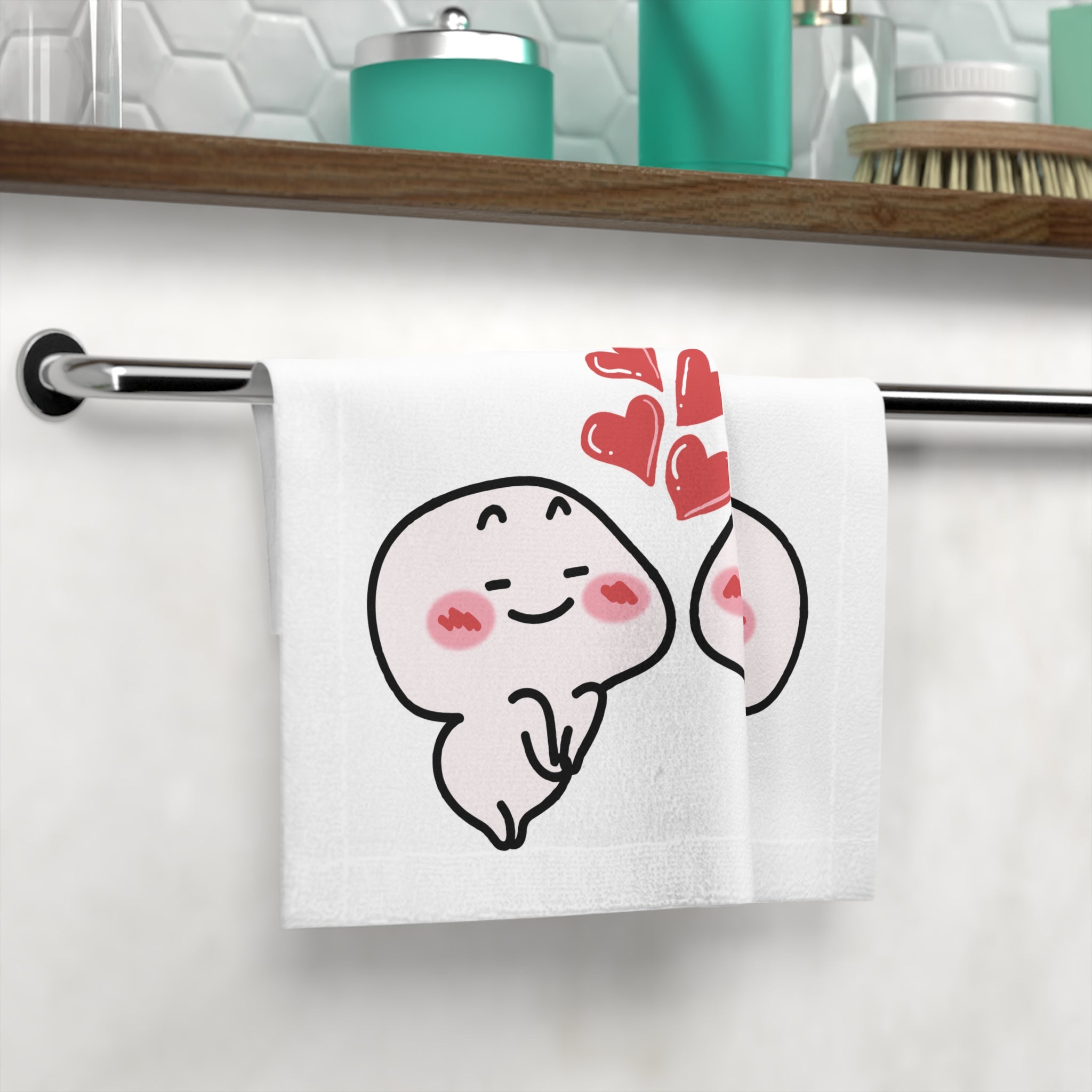 Too Cute After-Sex Cum Towel displayed on a bathroom towel rack, featuring a fun design with blushing characters and hearts. A sexy and playful addition to intimate essentials.