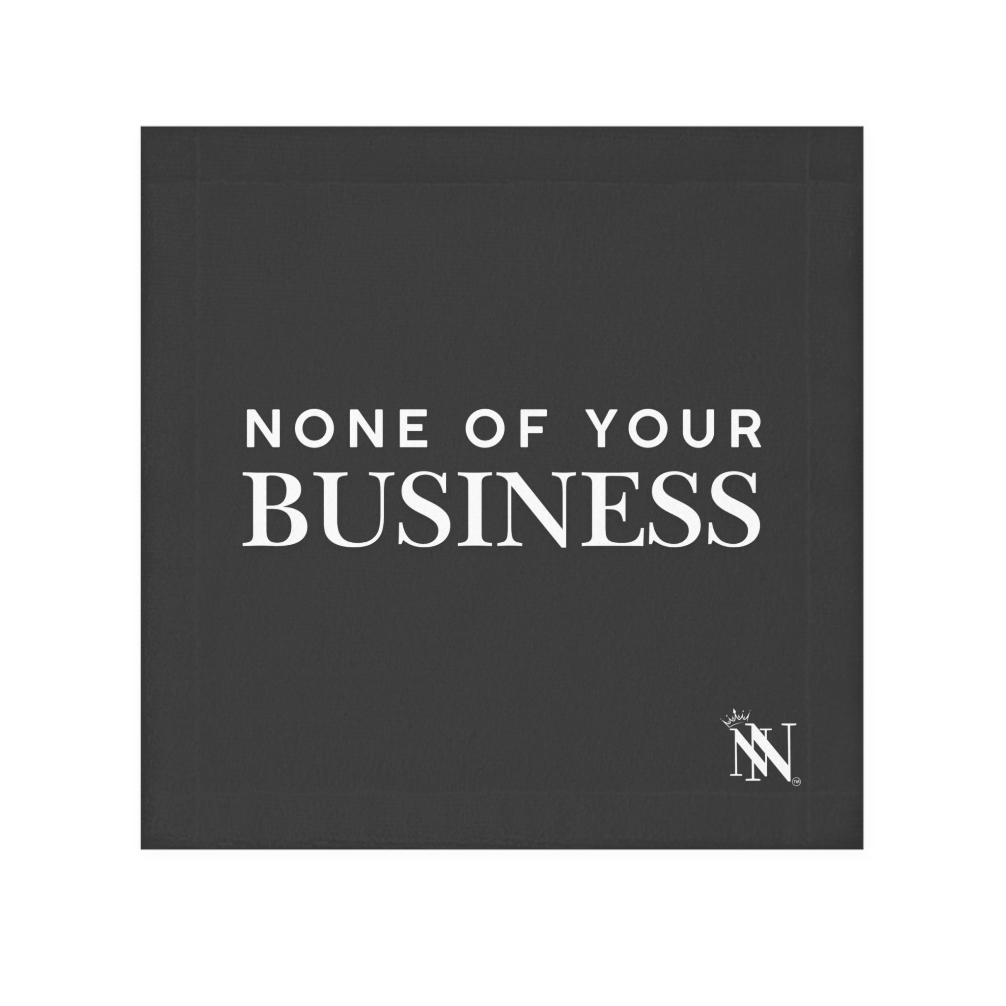 Black hand towel with bold white text 'None of Your Business' and a small decorative logo in the corner. Fun and flirty design for intimate moments.