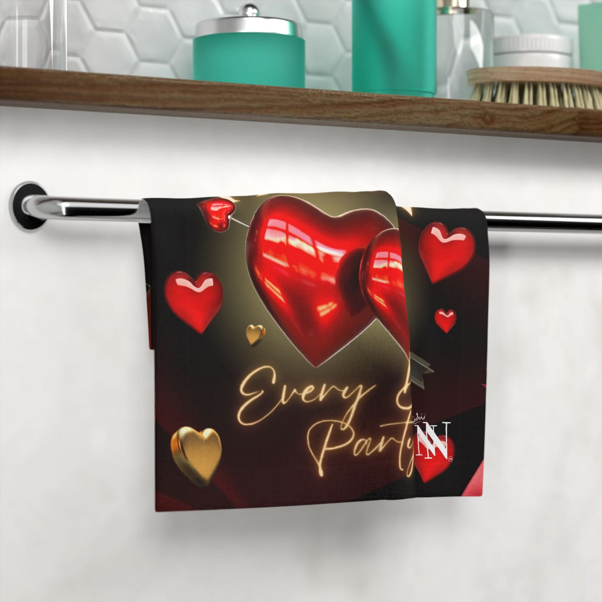 Love & Passion Everyday Best After-Sex Towel featuring a flirty heart design in red and gold, hanging on a bathroom towel rack. Perfect for intimate moments and romantic cleanup.