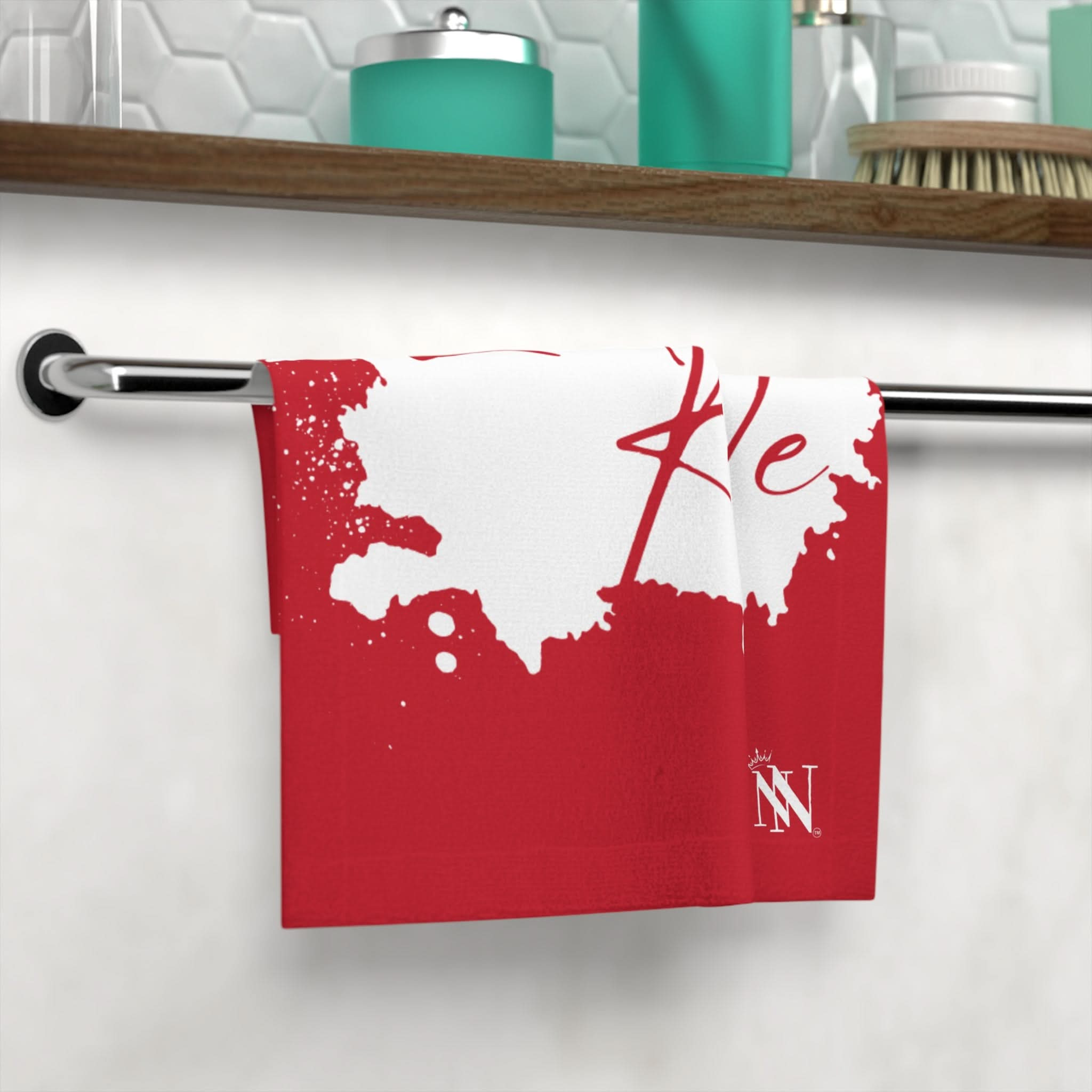 Ladies Rule Best After-Sex Towel in red and white with playful design, hanging on a bathroom towel rack. Fun and flirty intimate essential.